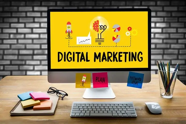 digital marketing on a laptop screen in yellow background