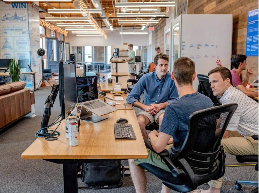 boys discussing in a workplace to resolve conflicts